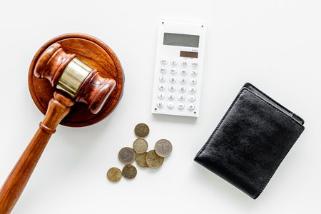 Bankruptcy concept. Judge gavel, wallet, coins, calculator on white background top view copy spaceの写真素材