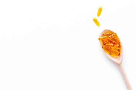 Reception of medicines concept. Pills in spoon on white background top view.の写真素材