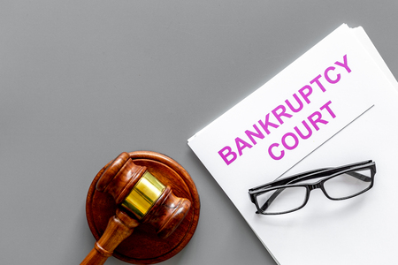 Title of documents the bankruptcy court near judge gavel on grey background top view copy spaceの写真素材