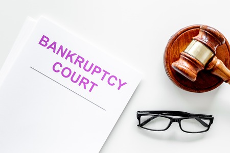 Title of documents the bankruptcy court near judge gavel on white background top view.の写真素材