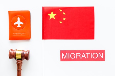 Immigration concept. Text visa near passport cover and flag.の写真素材