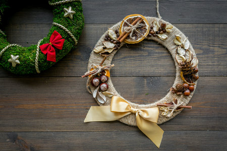 Set of different festive christmas wreath on dark wooden background top view copy spaceの写真素材