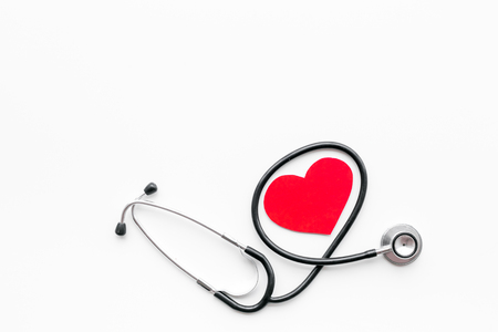 Heart disease concept. Stethoscope near heart sign on white background top view copy spaceの写真素材