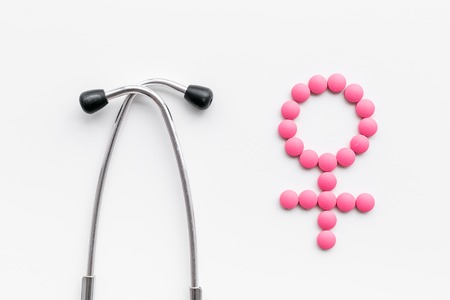 Female diseases concept. Stethoscope near female sign on white background top viewの写真素材