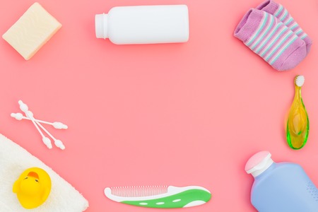 Hygiene items for the child. Bath accessories on pink background top view.の写真素材