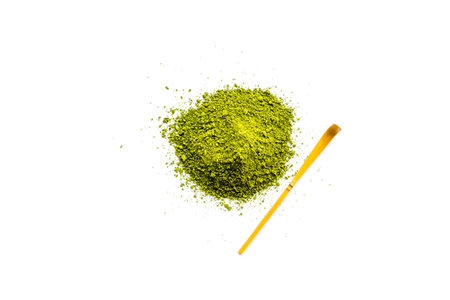 Pile of Matcha powder and specail stick on white background top view.