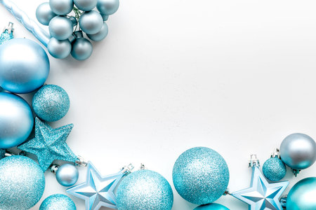Christmas tree toys background. Blue balls and stars on white background top view.の写真素材