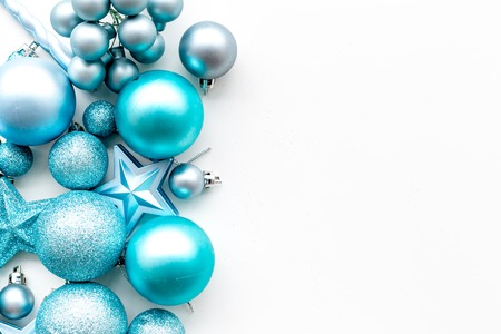 Christmas tree toys background. Blue balls and stars on white background top view.の写真素材