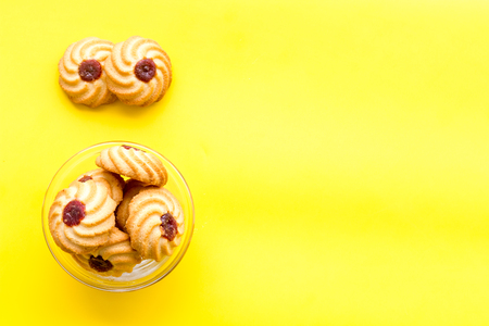 Homemade cookies. Kurabe in glass bowl on yellow background top view.の写真素材