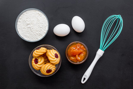 Cook cookies at home concept. Ingredients and instruments for make cookies. Fresh cookies near...
