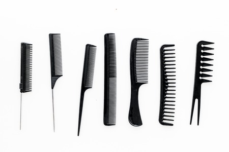 female hairdresser desk with accessories and combs on white background top viewの写真素材