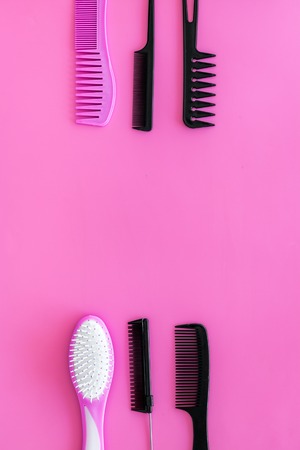 professional accessories of hairdresser on work desk pink background top view space for text.の写真素材
