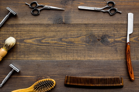 Barber workspace in barbershop with equipment on wooden background top view space for textの写真素材