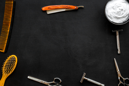 Barbershop desk with tools for male care on dark background top view mock-upの写真素材