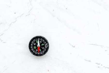 Direction concept with compass on stone office table background top view mockupの写真素材