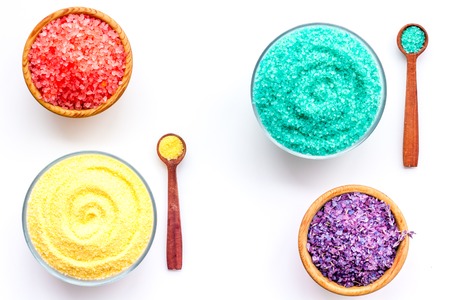Spa salt background. Colorful spa salt in bowls on white background top view.の写真素材
