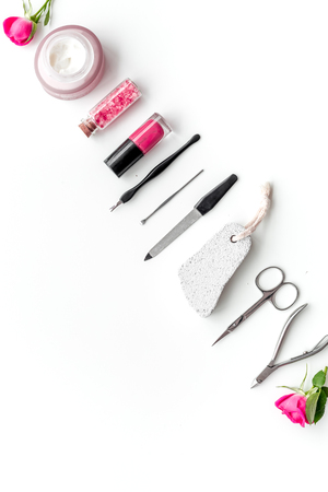 Tools for manicure with spa salt and rose on white desk background top view mock upの写真素材