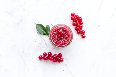 Homemade spa with wineberry cosmetic set on white table background top view