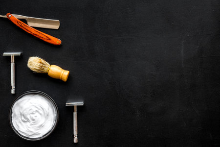 Barbershop desk with tools for male care on dark background top view mock-up