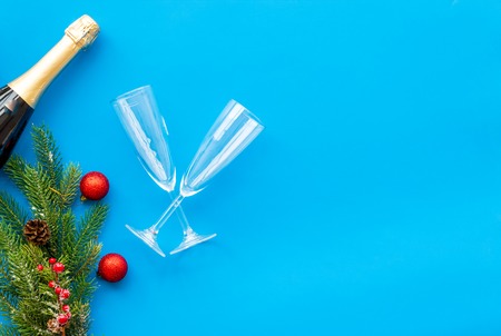 New year 2019 design with spruce, champagne bottle and glasses on blue table background top view space for textの写真素材