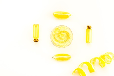 Homemade spa with citrus cosmetic oil on white deskの写真素材