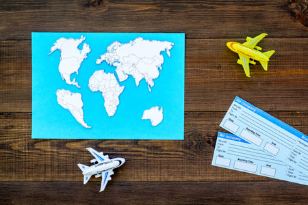 Tourist set with toys and tickets for traveling with kids on wooden