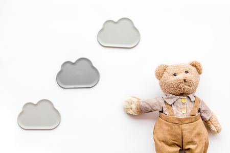 Craft toys for kids. Handmade teddy bear. White deskの写真素材