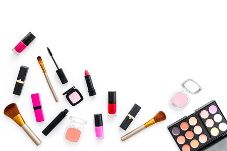 decorative cosmetics on woman desk white background top view mockupの写真素材