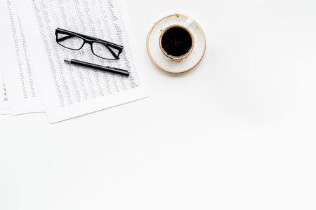 Business lunch with pencil, document and black coffee on work desk white background top view mock upの写真素材