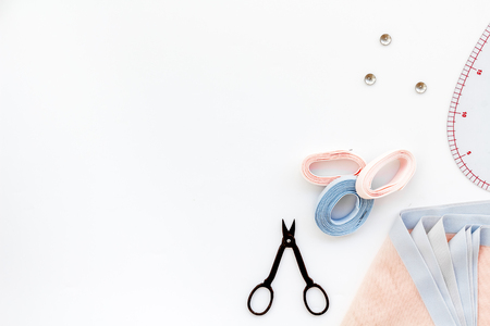 Hobby sewing with thread, scissors, fabric. Lifestyle. White background top view mock upの写真素材