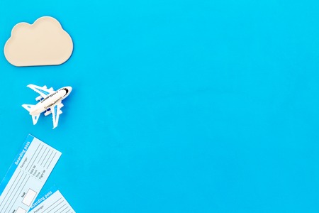 Accessories for traveling with children, tickets and toys on blue background top view mock-upの写真素材