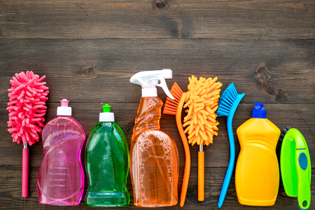 House cleaner tools set with detergents, soap, cleaners and brush on wooden background top view mock upの写真素材