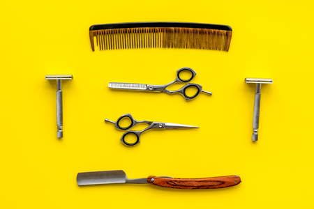 Barber workspace in barbershop with equipment yellow background top viewの写真素材