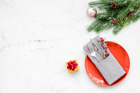 Christmas and new year celebration with gift and fir tree on white table background top view mock upの写真素材