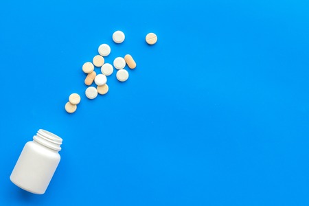 medical pills, antibiotics taking for care and health on blue background top view space for textの写真素材