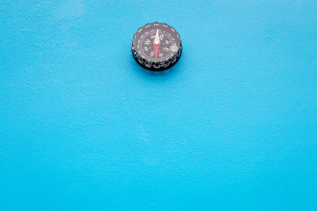 direction and movement concept with compass on wooden background top view mock upの写真素材