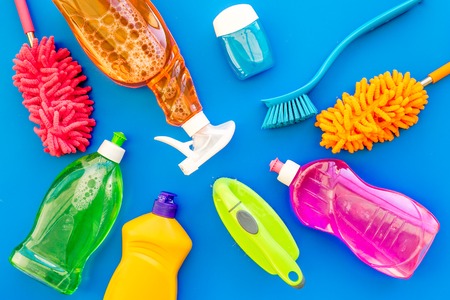 Housekeeping tool. Detergents, soap, cleaners and brush for house cleaner work on blue background top view space for textの写真素材