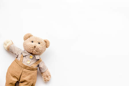 Handmade toys for newborn baby. Teddy bear. White background top view mockupの写真素材