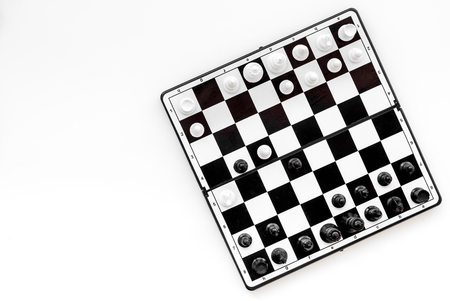 Chess game concept. Chess board with figures on white background top view space for textの写真素材