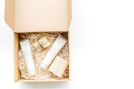 Delivery. Cardboard box with cosmetics on white background top view.の写真素材