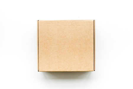Delivery concept. Cardboard box on white background top view.の写真素材