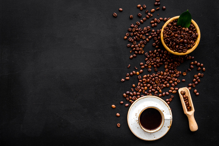 Coffee background with beans and cup of Americano black table flat lay space for textの写真素材
