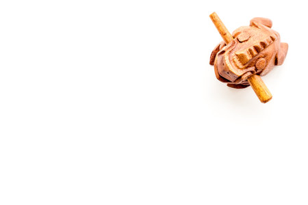 Buddhist symbol. Oriental wooden frog on white background top view.の写真素材
