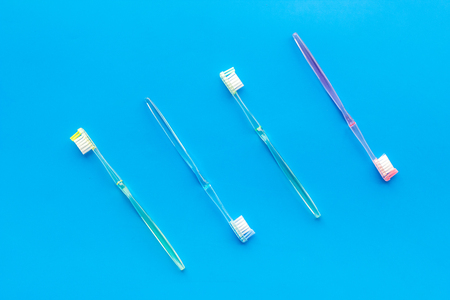 Oral hygiene. Plastic toothbrushes on blue background top view.の写真素材