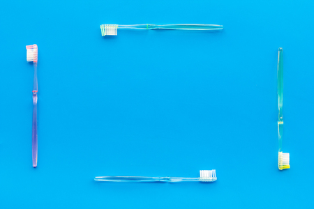 Oral hygiene. Plastic toothbrushes on blue background top view space for textの写真素材