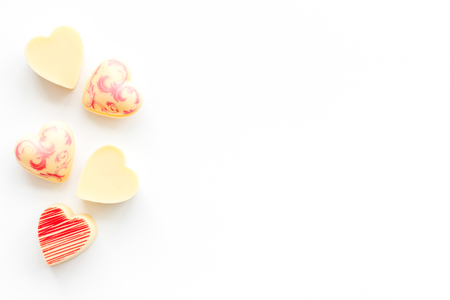 Heart-shaped confection for Valentines day on white background top view space for textの写真素材