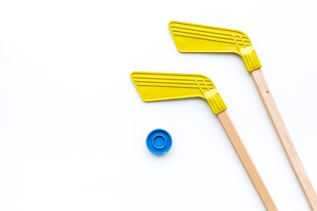 Ice hockey stick and puck on white background top view copy spaceの写真素材