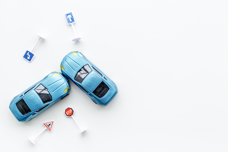 Toy cars for car insurance on white background top view mock upの写真素材