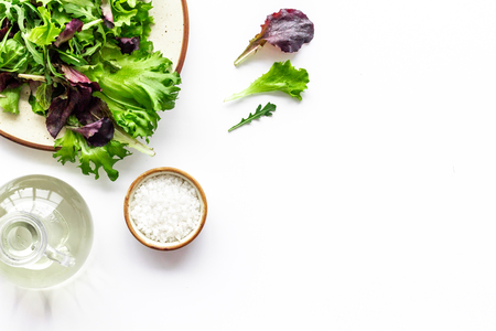 Fitness food cooking with organic green and red salad mix on white background top view copyspaceの写真素材