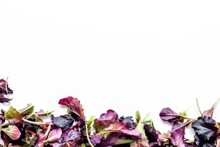 Green and red salad mix for healthy organic food on white background top view mock upの写真素材